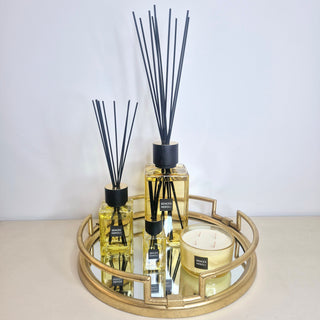 A collection of diffusers on a mirrored gold tray on display at Lily Bloom Sore, Gorey 