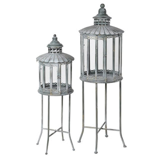 Set of 2 Heritage Lanterns from Lily Bloom with distressed grey-green finish, featuring large (H:1300mm) and small (H:1070mm) lanterns. Ideal for candles or fairy lights. Available at www.lilybloom.ie.