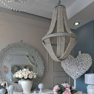 Seville Beaded Pendant – Large wooden bead chandelier with elegant draped detailing, perfect for adding warmth and sophistication to any space.  Buy online or instore at www.lilybloom.ie